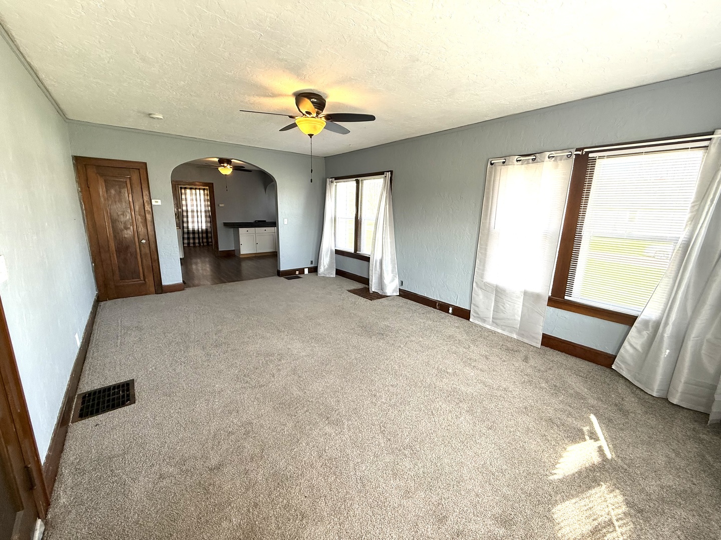 302 West Division Street Amboy, IL 61310 - Photo 9 of 23 an empty room with windows and fireplace