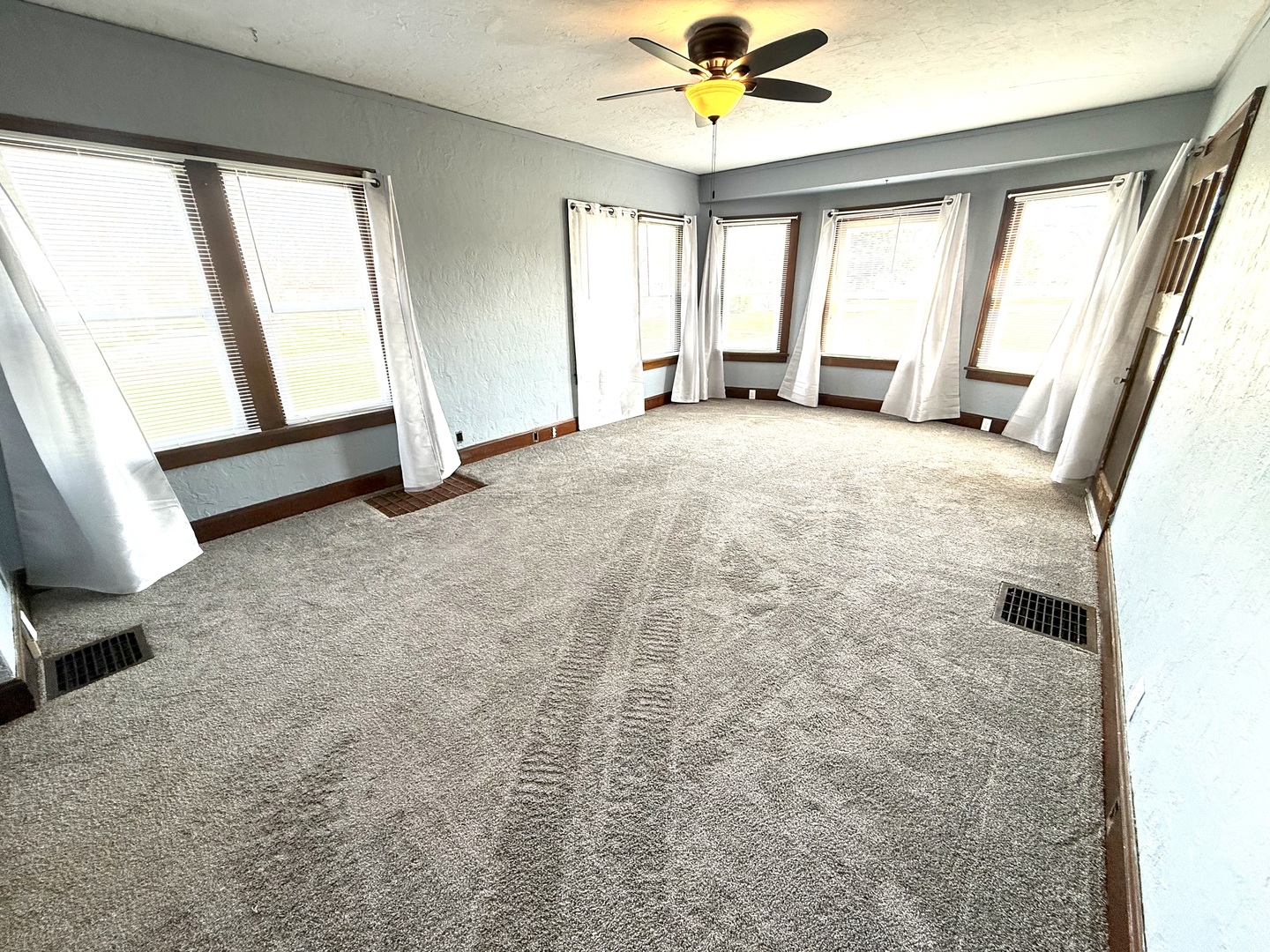 302 West Division Street Amboy, IL 61310 - Photo 10 of 23 a view of an empty room with a window