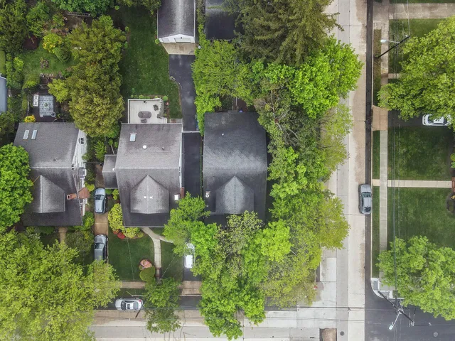 an aerial view of a house with outdoor space