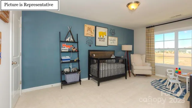 a bedroom with furniture and a window