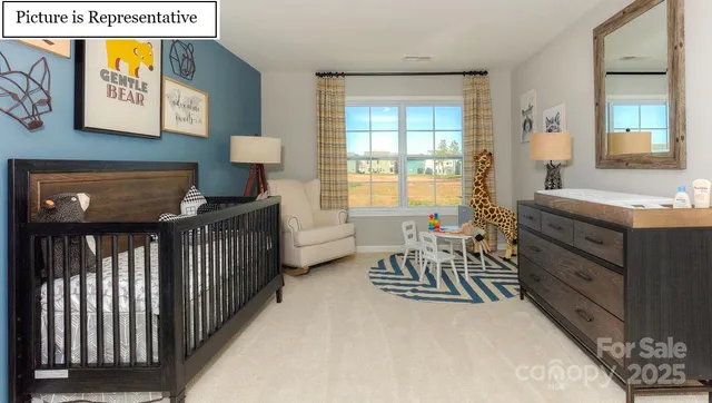 a bedroom with furniture and a window