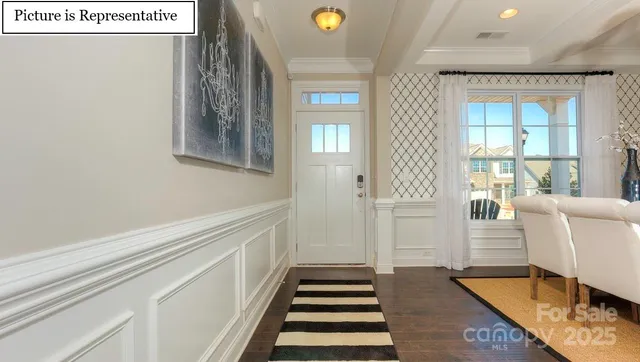 a hallway with windows and wooden floor