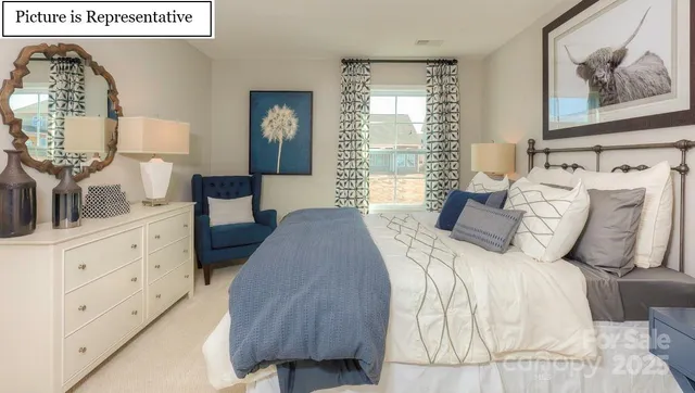 a bedroom with bed and window