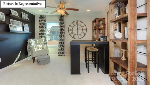 a living room with fireplace furniture and a window