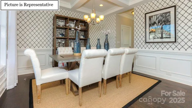 a living room with furniture a lamp and a potted plant