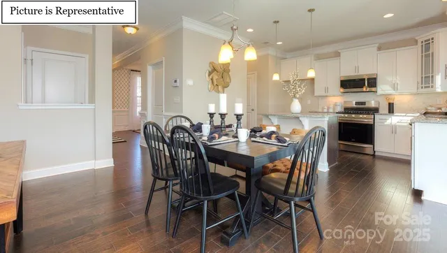 a view of a dining area with furniture and wooden floor