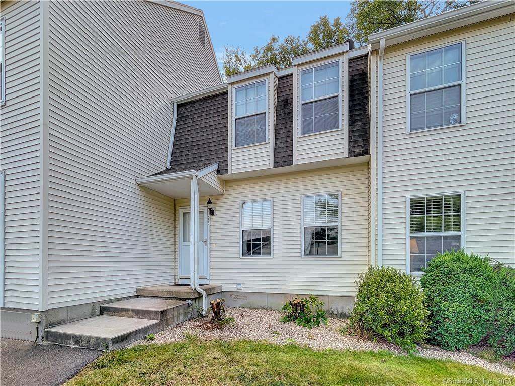 229 Branford Road, Unit 530 North Branford, CT 06471 - Photo 1 of 1 a front view of a house with garden