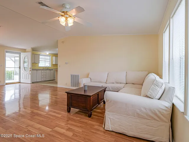 a large kitchen with a large counter top appliances and cabinets