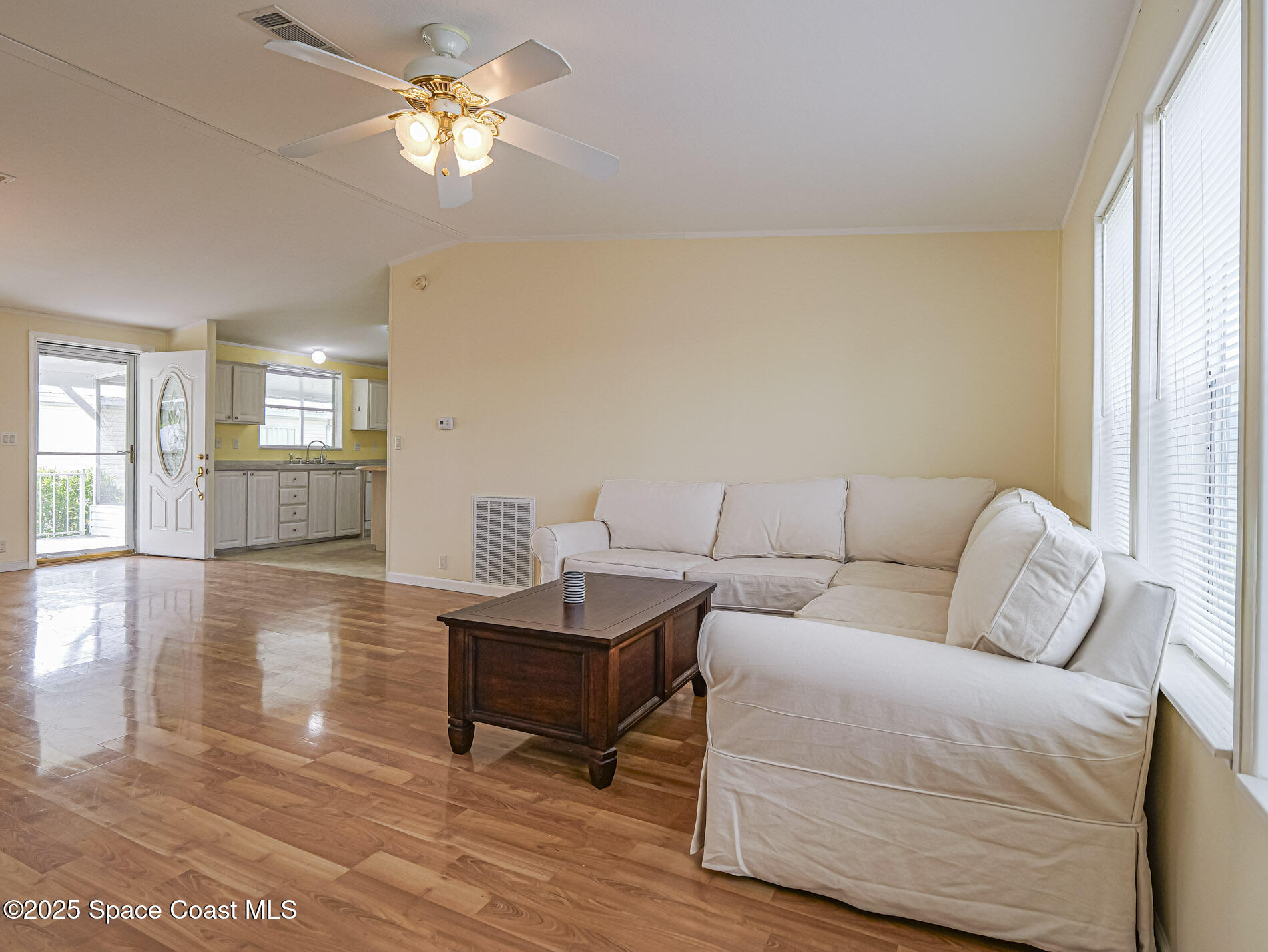 7620 Boxelder Road Micco, FL 32976 - Photo 12 of 47 a living room with furniture and a wooden floor