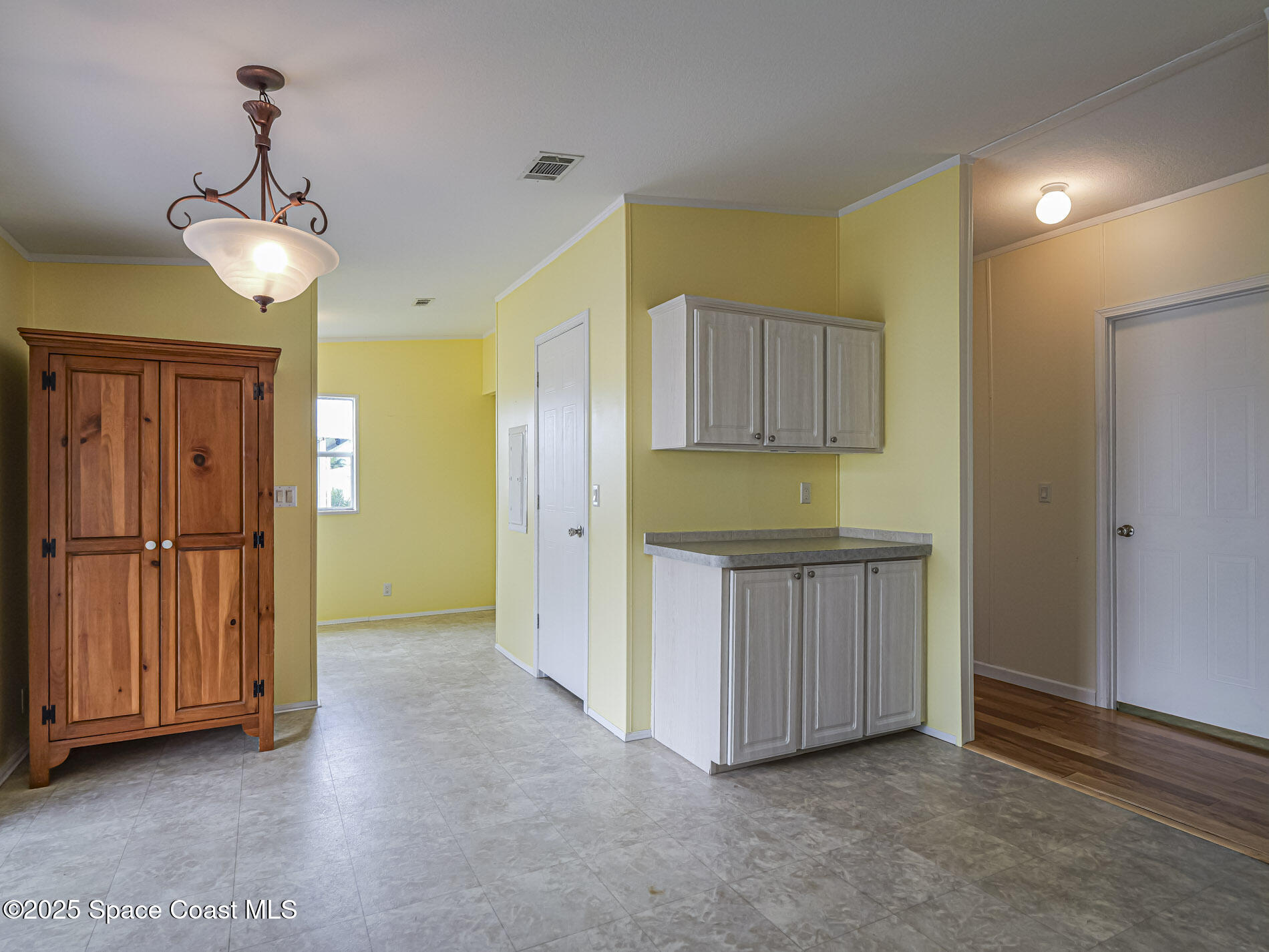 7620 Boxelder Road Micco, FL 32976 - Photo 14 of 47 a view of a kitchen with a sink and cabinet area