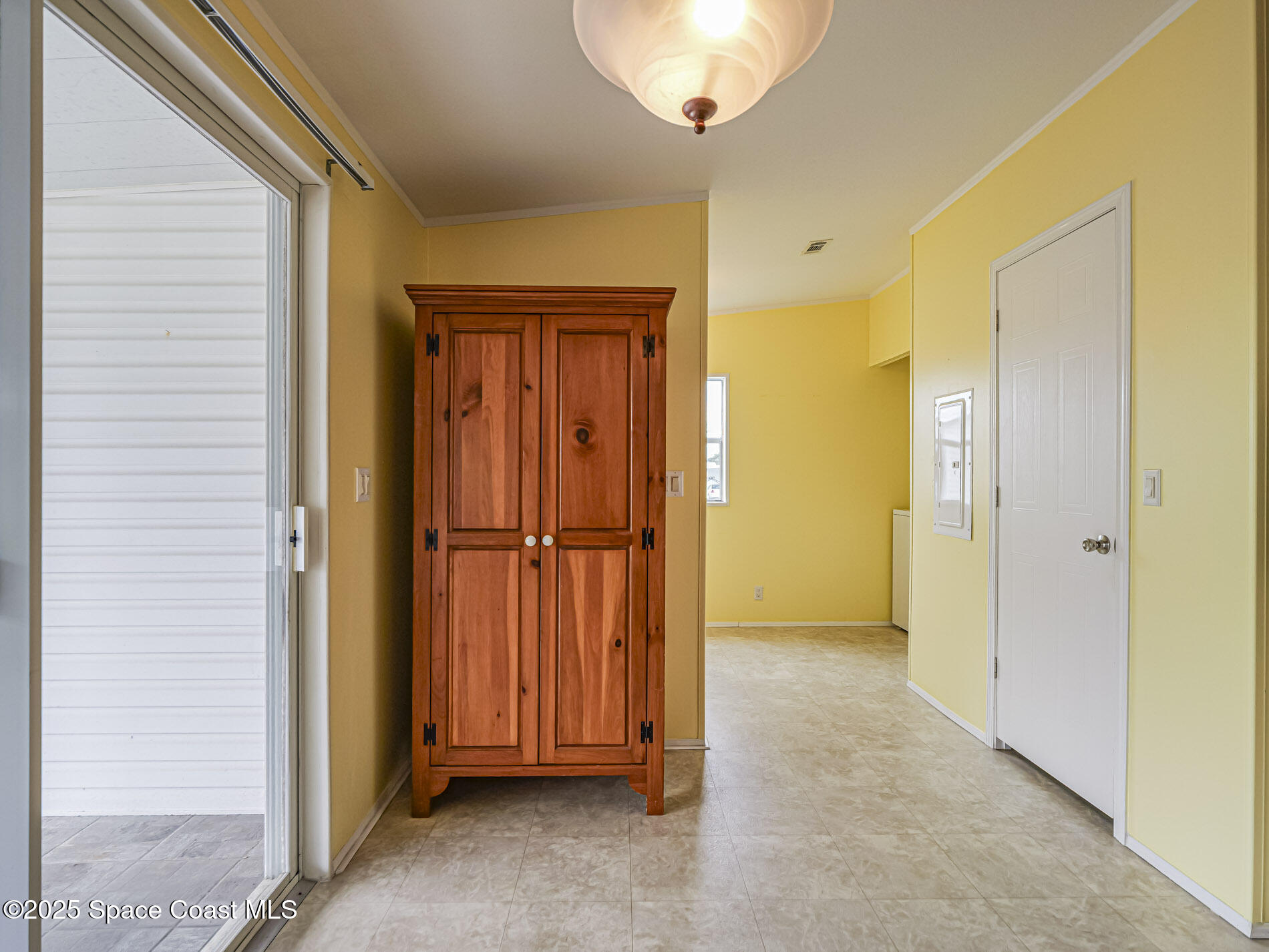 7620 Boxelder Road Micco, FL 32976 - Photo 17 of 47 a view of a livingroom with wooden floor and a bathroom