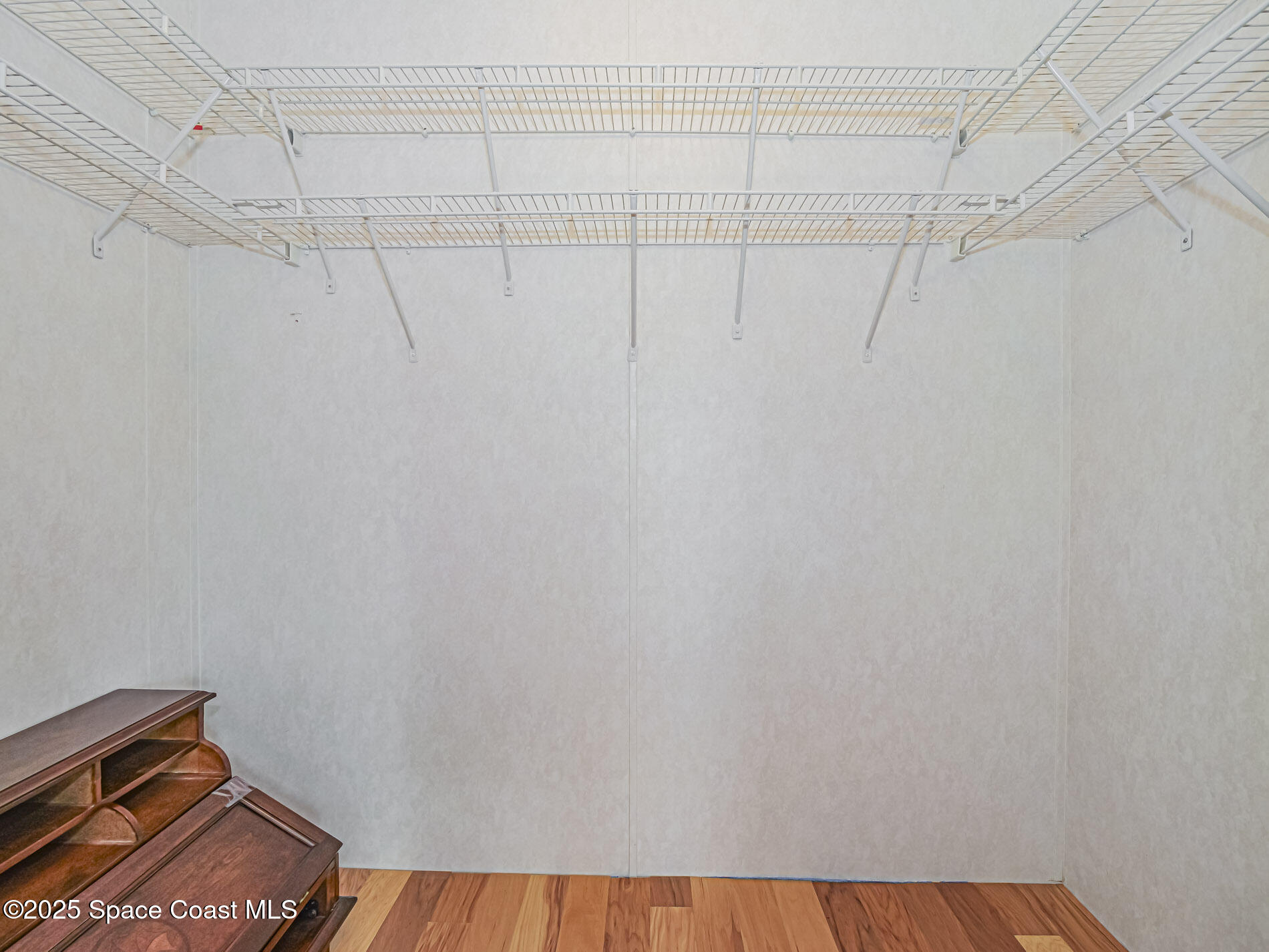 7620 Boxelder Road Micco, FL 32976 - Photo 24 of 47 a view of a room with racks on the wall