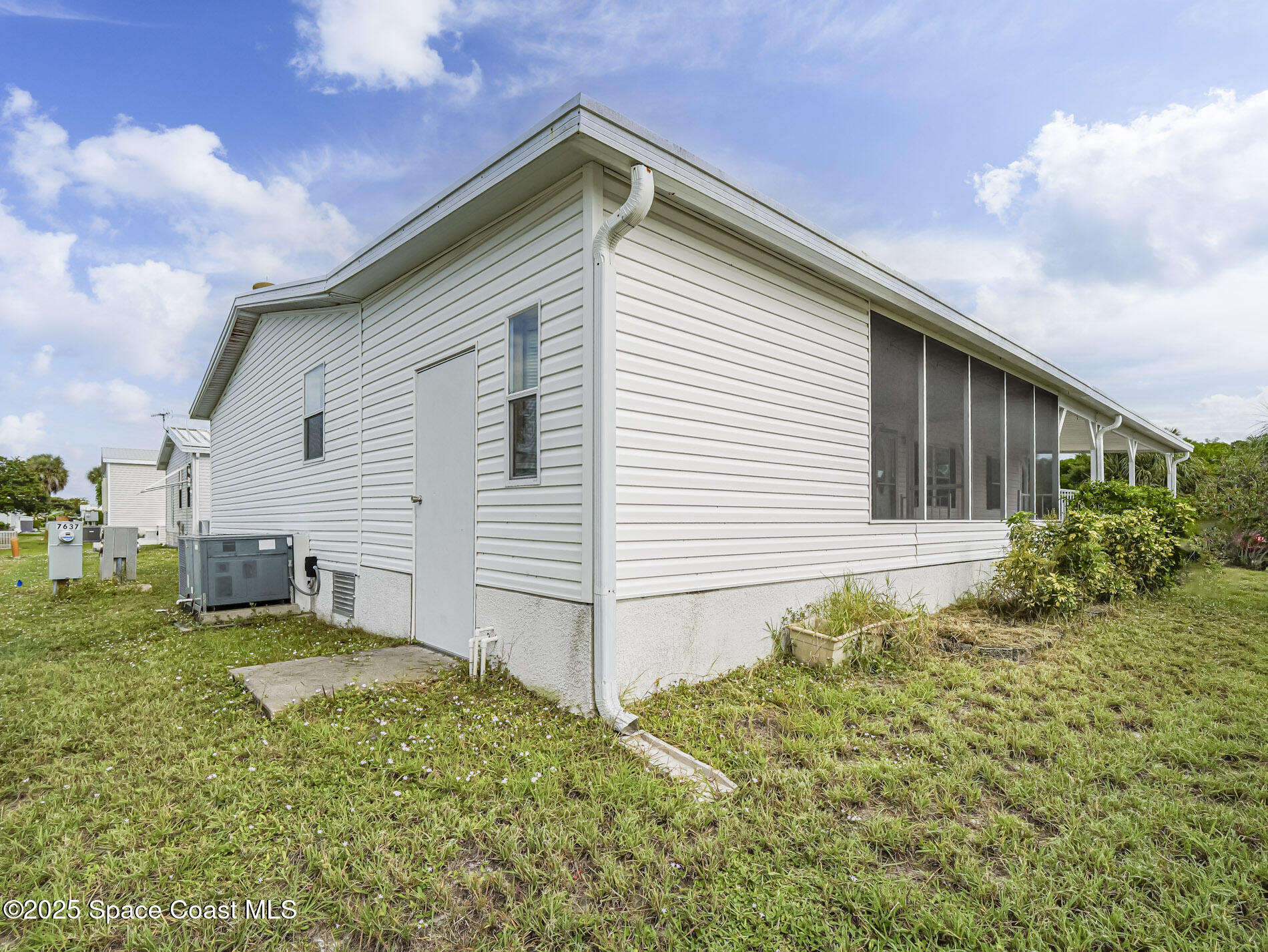 7620 Boxelder Road Micco, FL 32976 - Photo 36 of 47 a view of a house with a yard