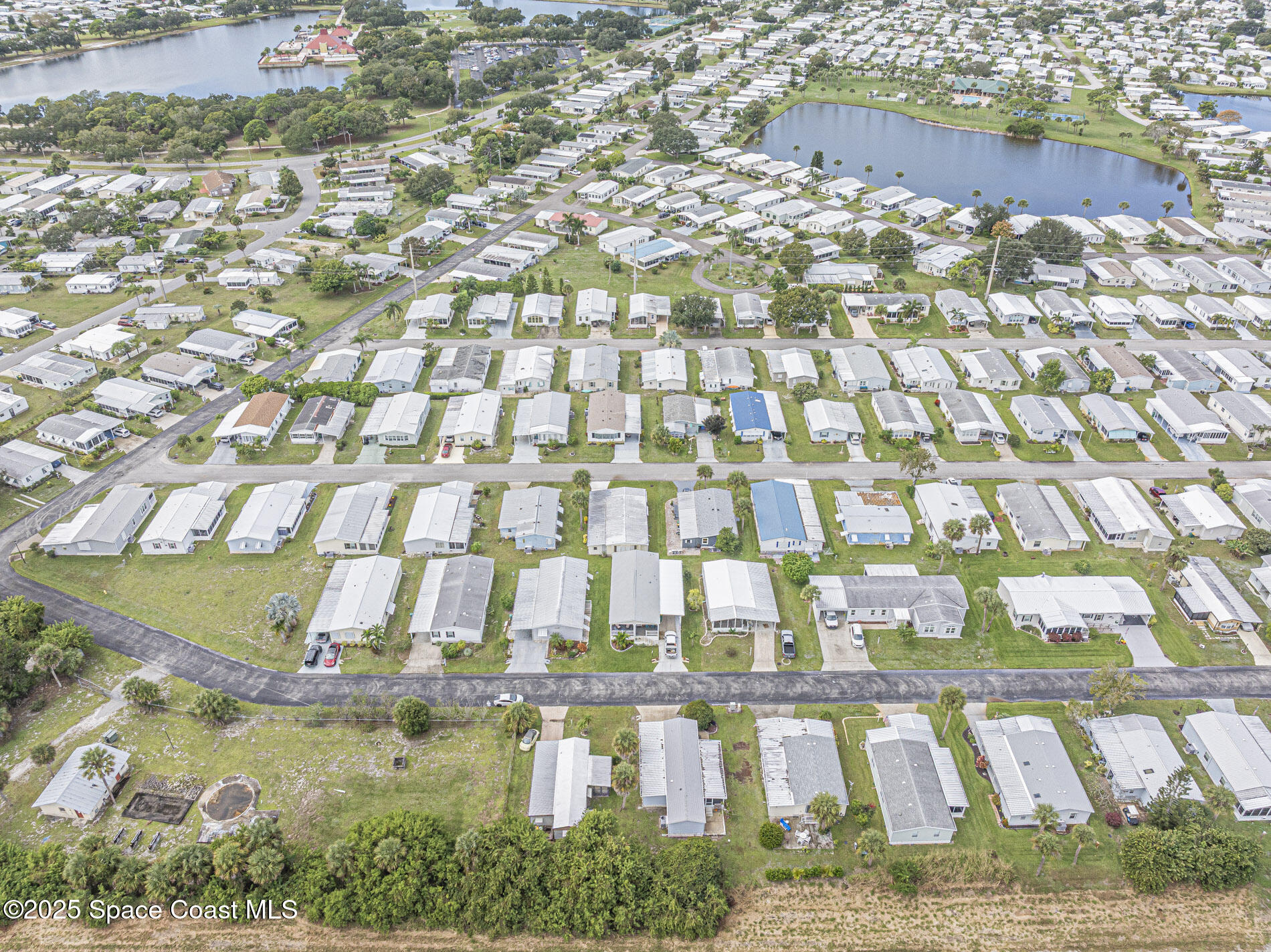 7620 Boxelder Road Micco, FL 32976 - Photo 42 of 47 a aerial view of a multi story building