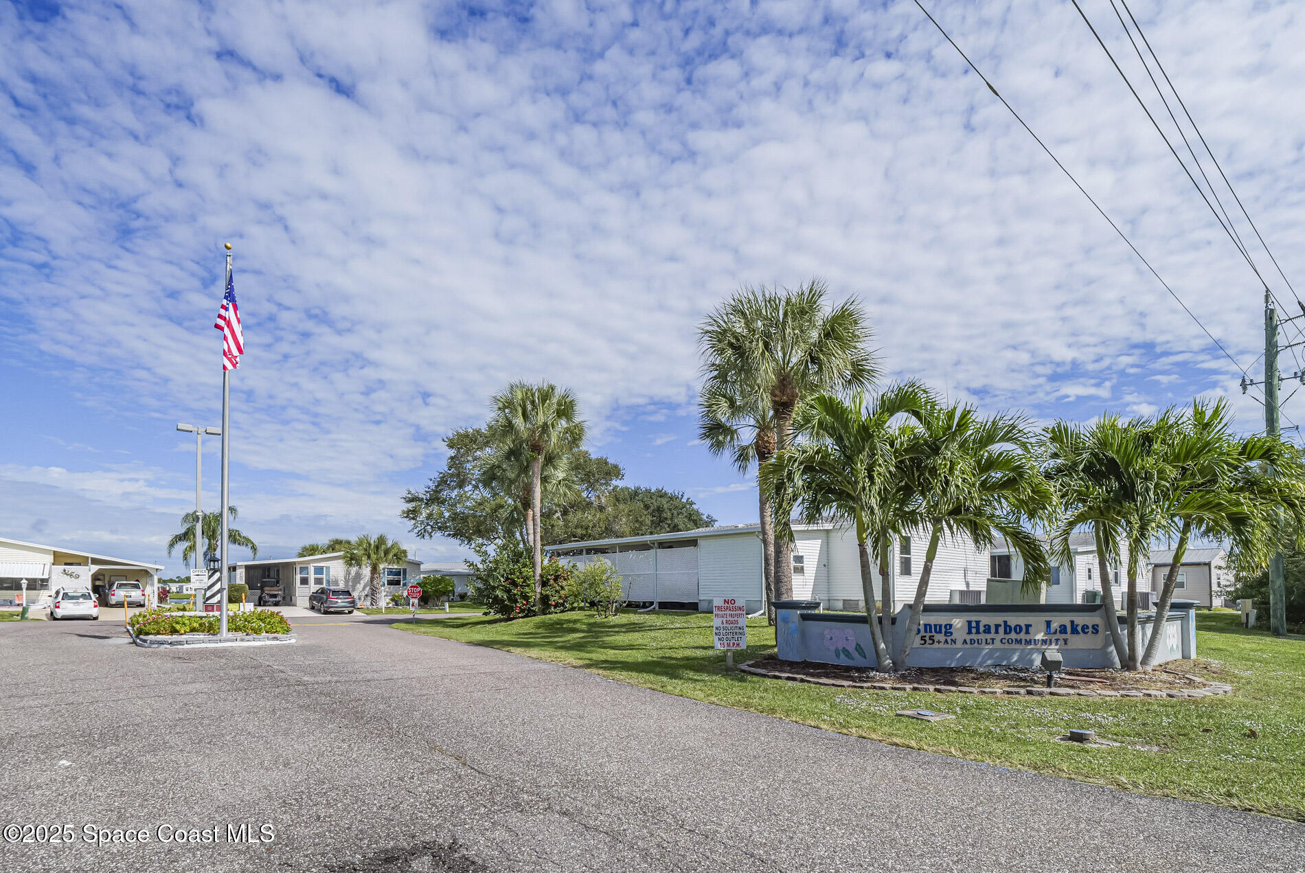 7620 Boxelder Road Micco, FL 32976 - Photo 5 of 47 a palm tree sitting in front of a white house