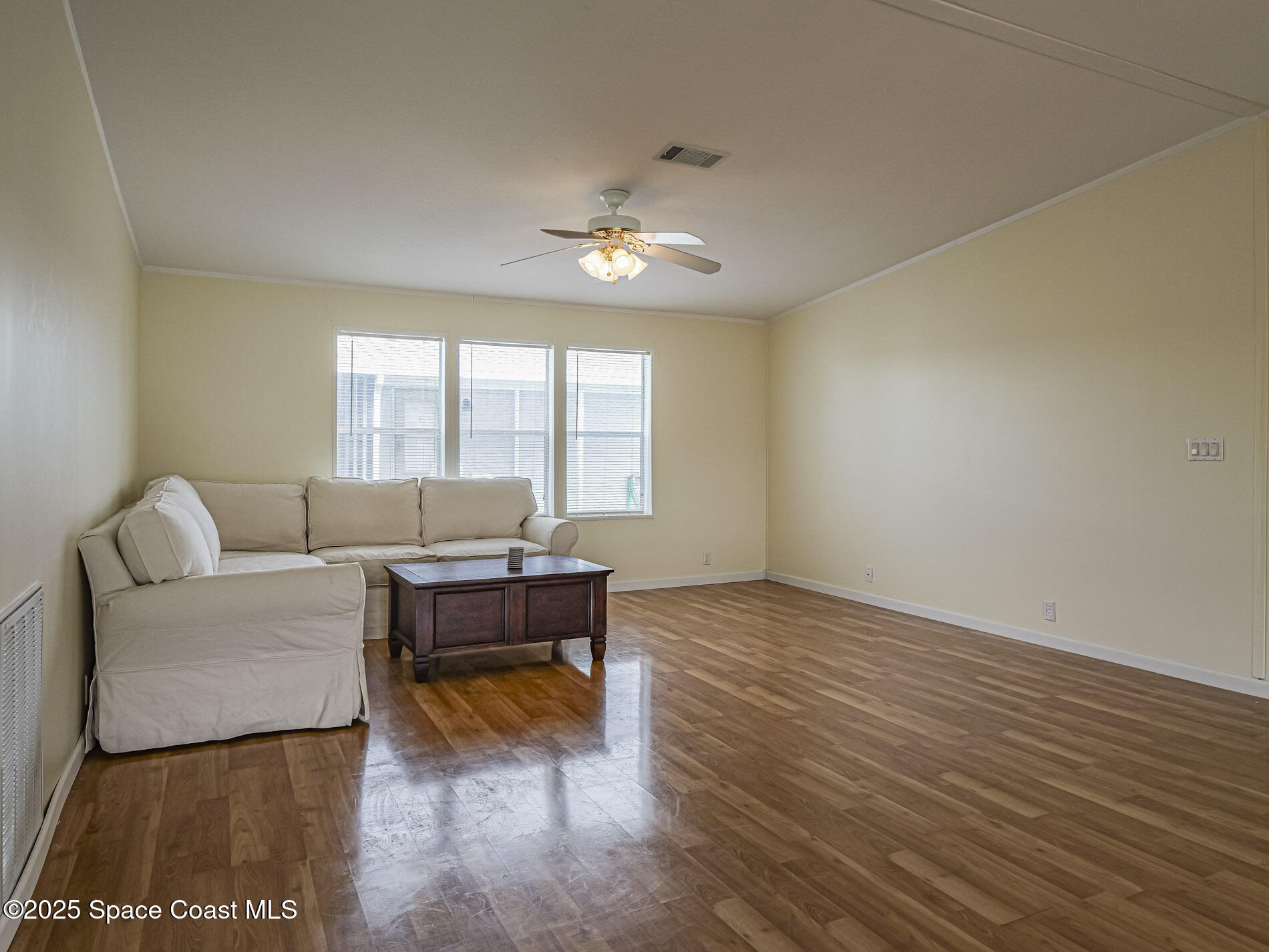 7620 Boxelder Road Micco, FL 32976 - Photo 10 of 47 a living room with furniture and a fireplace
