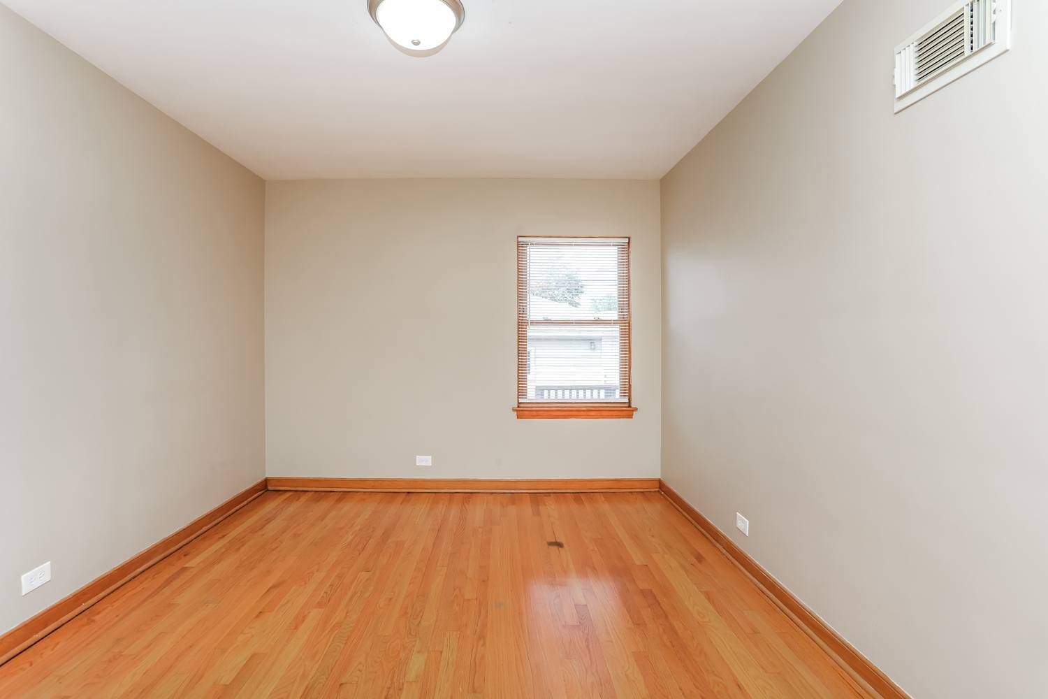 9006 West 22nd Place North Riverside, IL 60546 - Photo 5 of 14 a view of empty room with wooden floor and fan