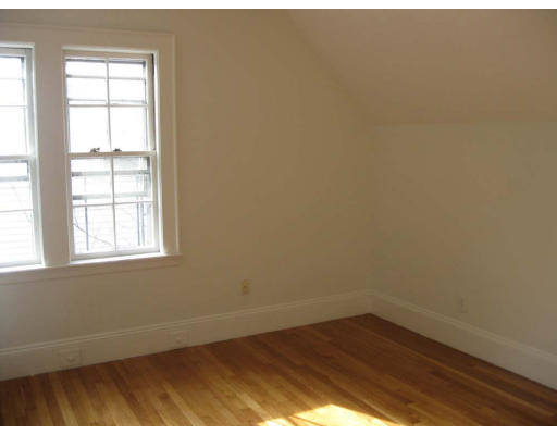 27 Algonquin Road Newton, MA 02467 - Photo 18 of 20 an empty room with wooden floor and windows