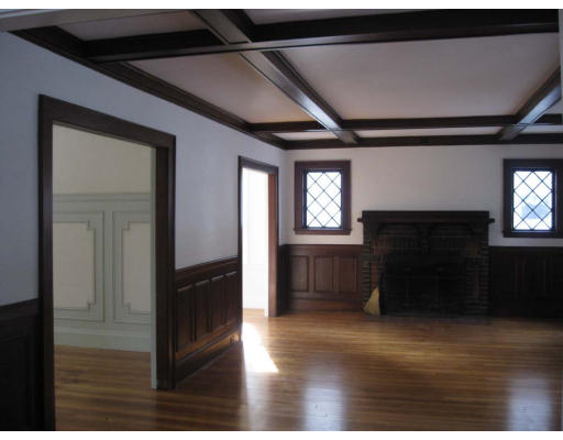 27 Algonquin Road Newton, MA 02467 - Photo 3 of 20 a view of a hallway with wooden floor and a fireplace