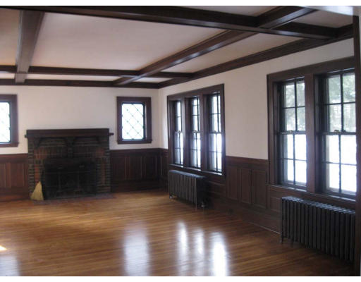 27 Algonquin Road Newton, MA 02467 - Photo 4 of 20 a view of an empty room with wooden floor and a window