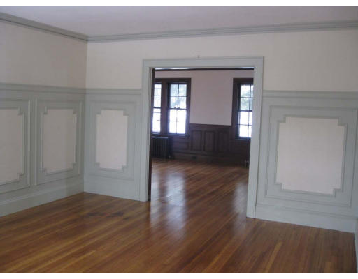 27 Algonquin Road Newton, MA 02467 - Photo 8 of 20 a view of empty room with wooden floor and fan