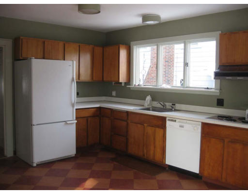 27 Algonquin Road Newton, MA 02467 - Photo 9 of 20 a white refrigerator freezer sitting in a kitchen
