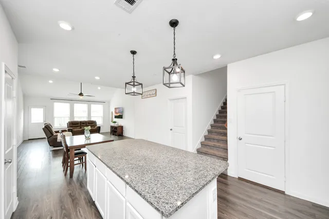 a kitchen with a table and chairs