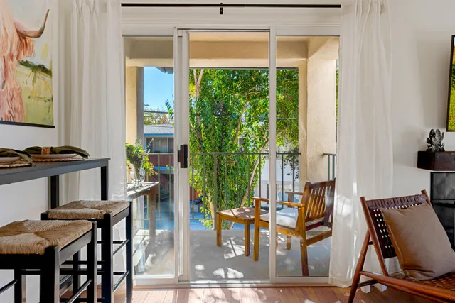 a view of a dining room with furniture window and outside view