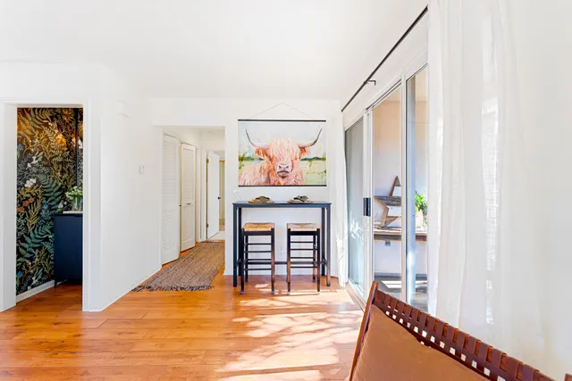 a view of a livingroom with furniture and window