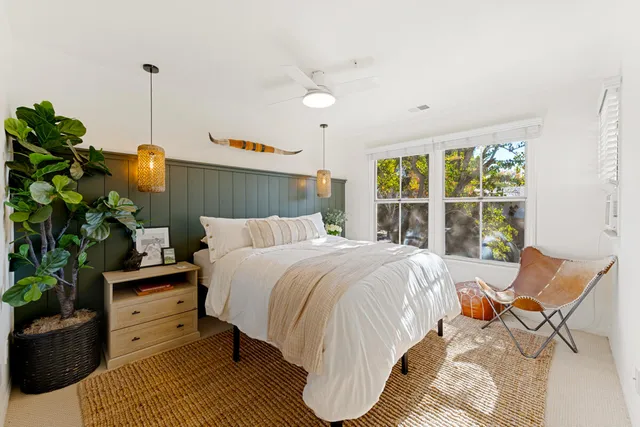 a bed room with a bed and a window