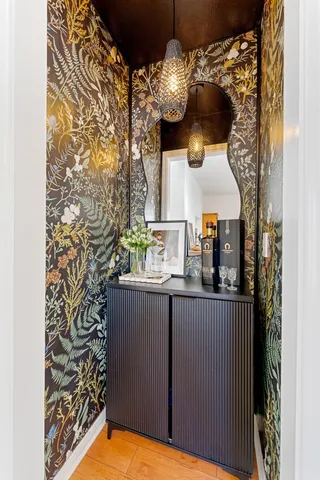 a kitchen with a sink and chandelier