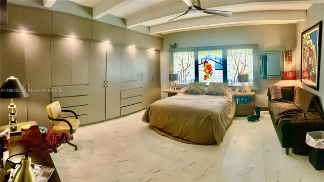 a bedroom with a bed and gym equipment