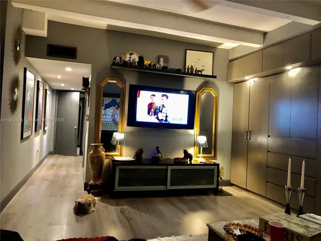 a room with furniture and a flat screen tv