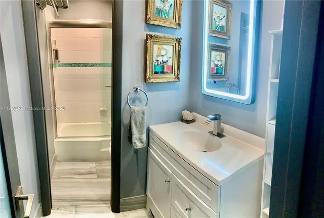 a bathroom with a sink and a mirror