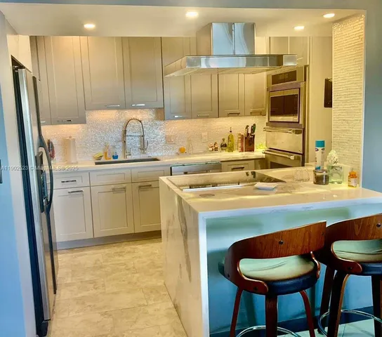 a kitchen with a sink cabinets and window