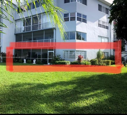 a view of building with yard