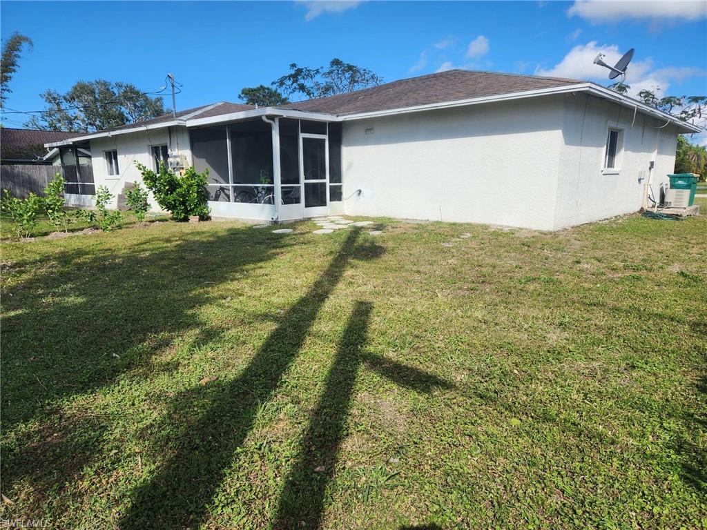 650 103rd Avenue North Naples, FL 34108 - Photo 12 of 13 a front view of a house with garden