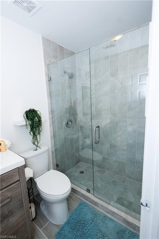 650 103rd Avenue North Naples, FL 34108 - Photo 7 of 13 a bathroom with a toilet and a shower
