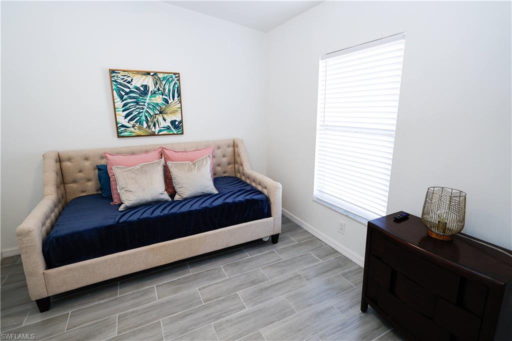 650 103rd Avenue North Naples, FL 34108 - Photo 9 of 13 a bedroom with a bed and a window