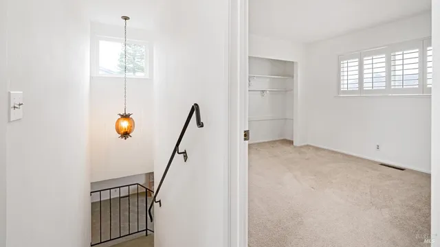 a view of a room with window and bathroom