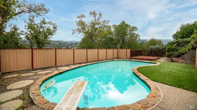 a view of a swimming pool with a sitting area