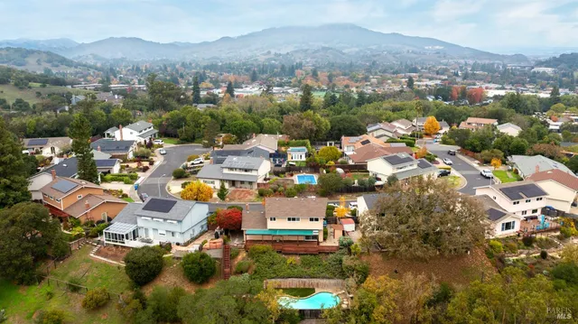 an aerial view of residential houses with outdoor space
