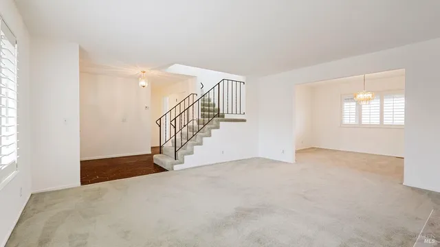 a view of an empty room with stairs