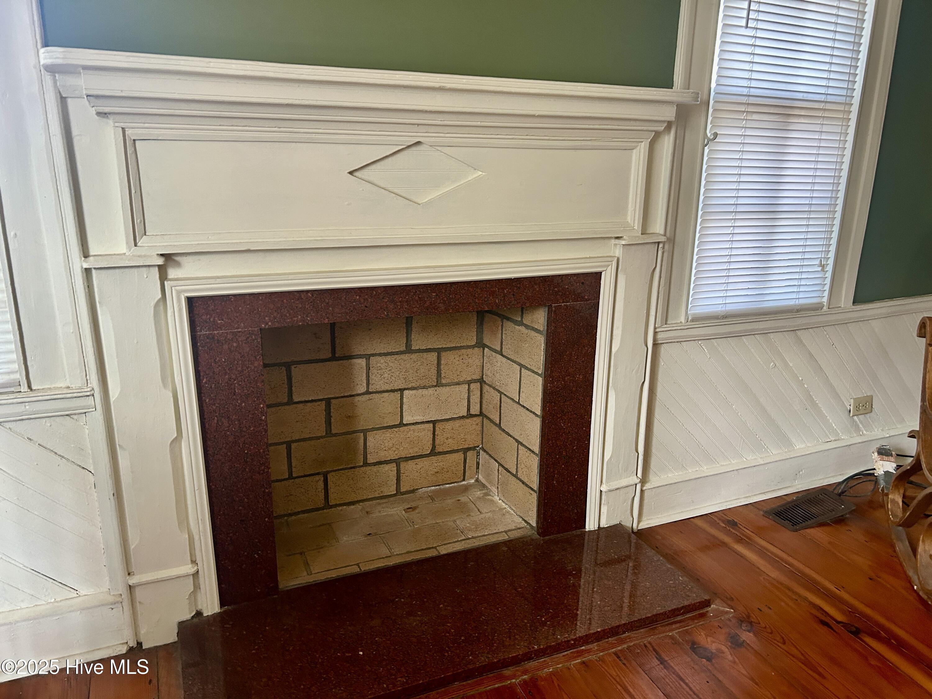 248 Highway 305 Windsor, NC 27983 - Photo 19 of 57 fireplace in downstairs bedroom; beautiful stone surround and mantle