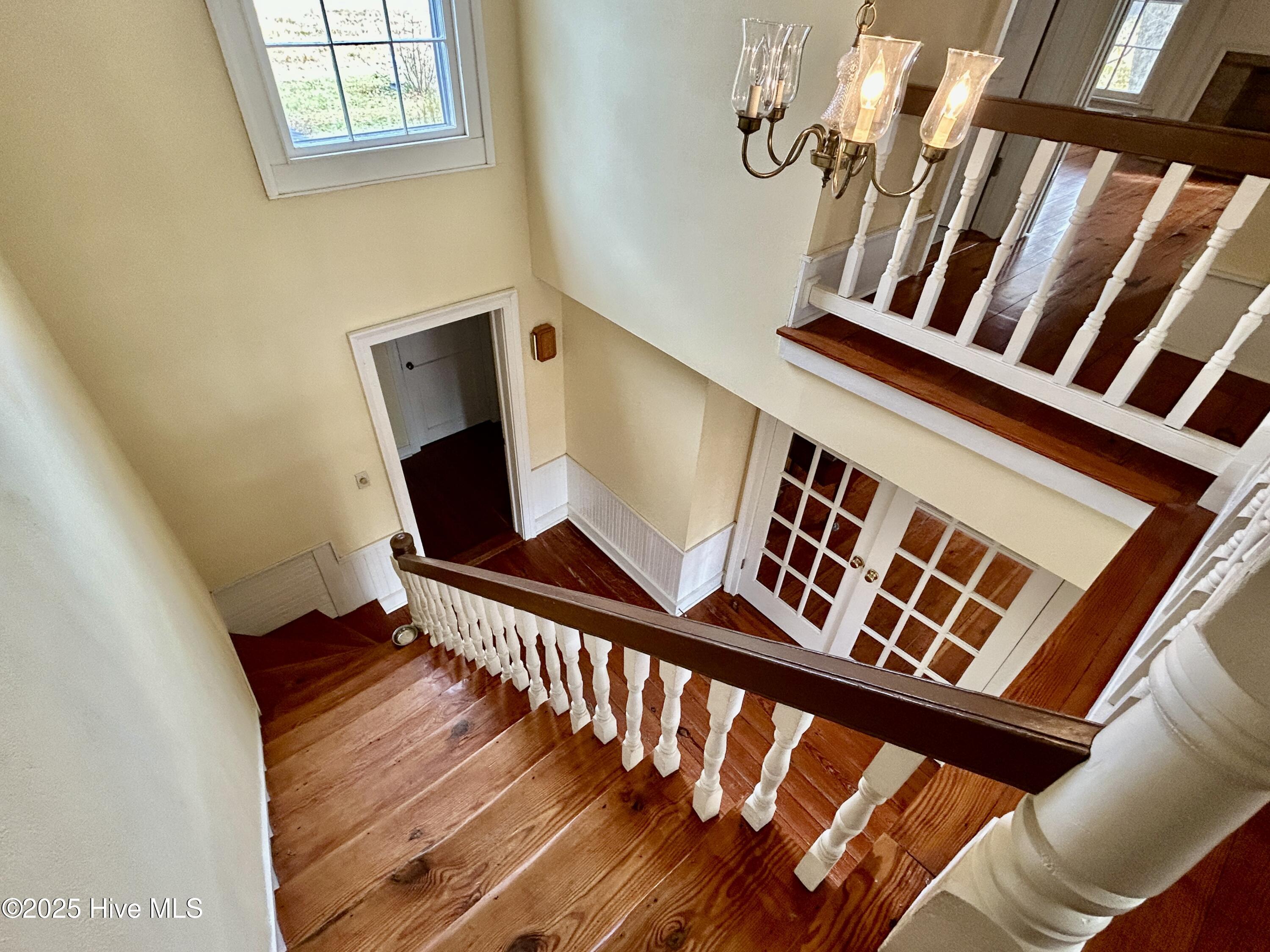 248 Highway 305 Windsor, NC 27983 - Photo 46 of 57 view from upstairs landing into foyer, showing living room French doors