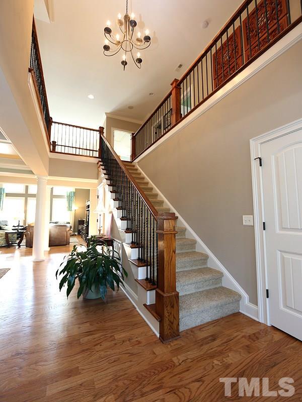 12913 Baybriar Drive Raleigh, NC 27613 - Photo 3 of 25 a view of entryway and hall with wooden floor