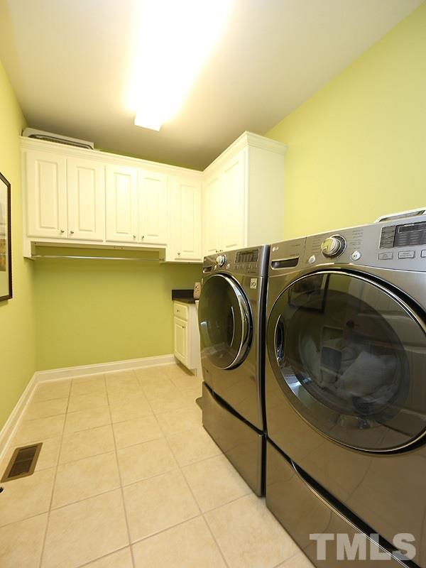 12913 Baybriar Drive Raleigh, NC 27613 - Photo 21 of 25 a utility room with washer and dryer