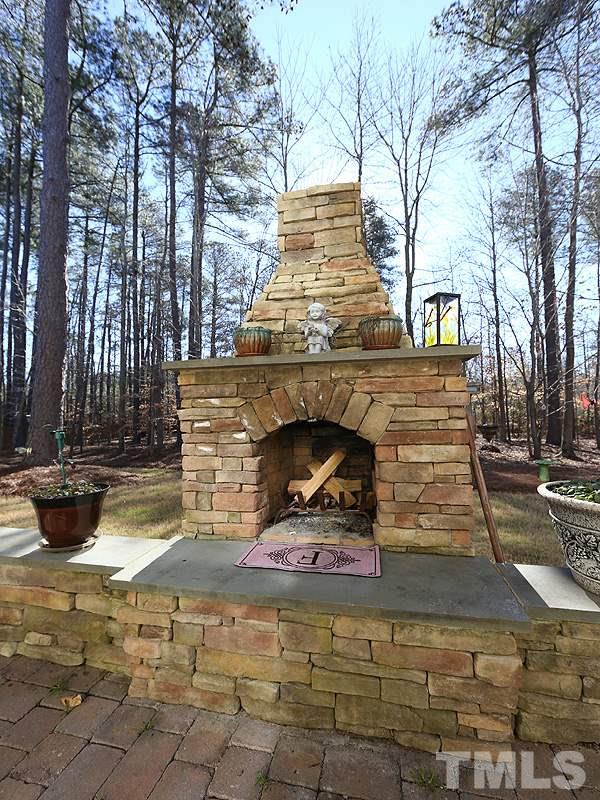 12913 Baybriar Drive Raleigh, NC 27613 - Photo 24 of 25 a front view of a house with garden