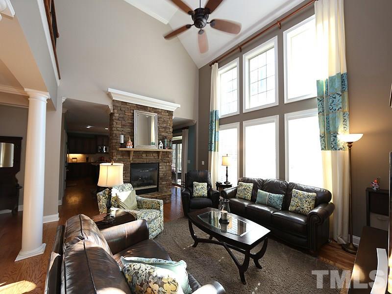 12913 Baybriar Drive Raleigh, NC 27613 - Photo 6 of 25 a living room with furniture and a large window