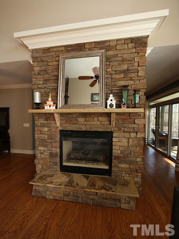 12913 Baybriar Drive Raleigh, NC 27613 - Photo 8 of 25 a living room with fireplace